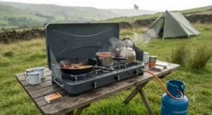 A robust 3-burner camping stove with integrated windshields to ensure consistent heat during breezy British weather.