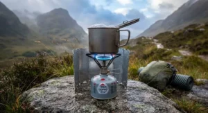 A clear view of the steady, powerful flame from an ultralight gas stove during a wind-tested cooking session.