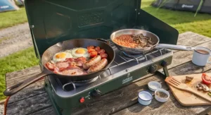Close-up view of a cooked breakfast being prepared on a high-performance freestanding double burner camping stove.