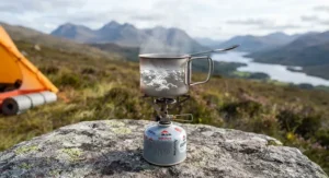 Close-up of the best ultralight gas stove quickly boiling water for a cup of tea in the Highlands.