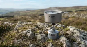 The stability of a full camping pot resting on the Soto WindMaster pot supports on uneven terrain