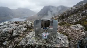 Using a windshield with a propane butane mix for backpacking stove during a chilly hike